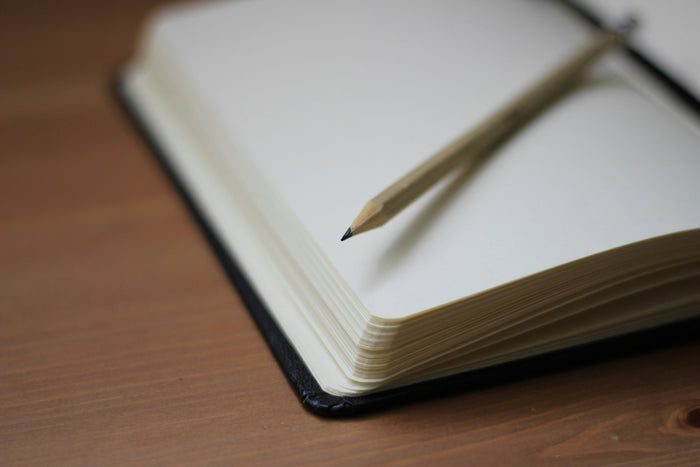 Notizbuch mit Bleistift